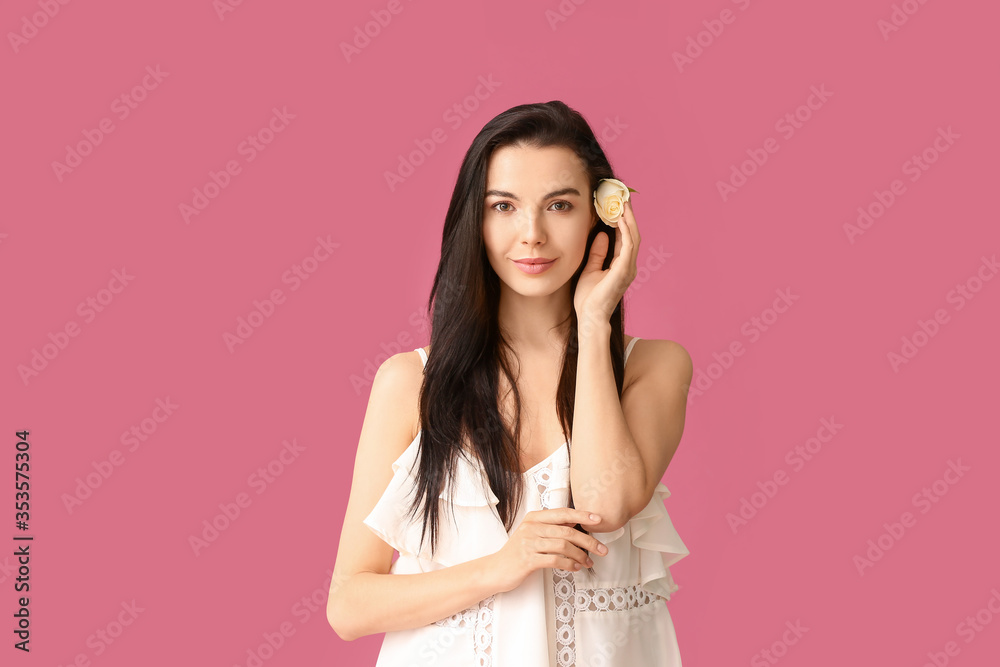 Beautiful young woman with rose on color background Beautiful young woman with rose on color background