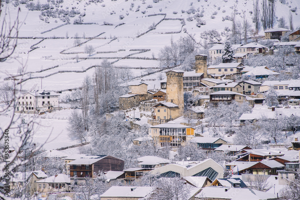 Snowy And Sunny Mestia In The Winter. Old Stone Towers