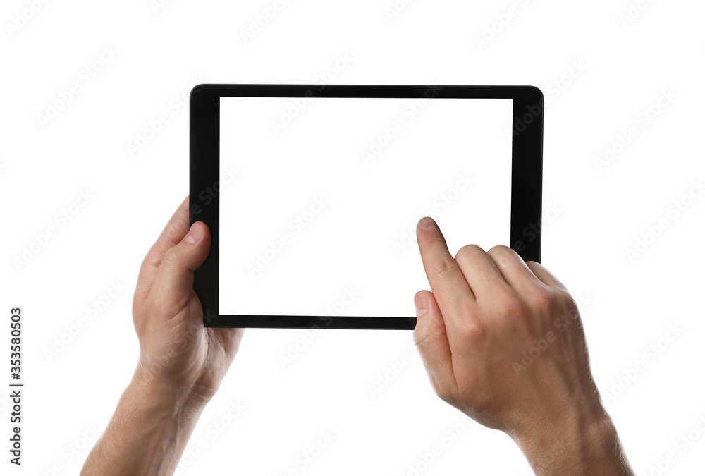 Man using tablet computer with blank screen on white background, closeup. Modern gadget