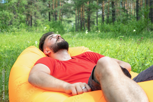 bearded man of caucasian nationality relaxing and enjoying outdoor. recreation, stress relief