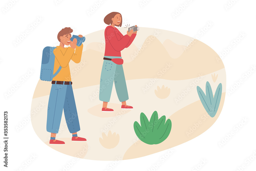A couple of tourists hiking. A concept of trekking. A boy watching in binoculars and girl taking pictures with camera.