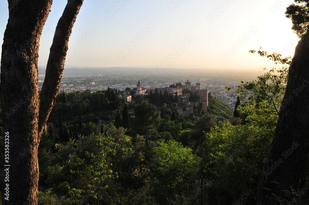 Sunset over the city of Granada, Andalusia, Spain. Alhambra palace and Albaicín Moorish quarter