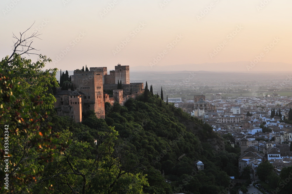 Sunset over the city of Granada, Andalusia, Spain. Alhambra palace and Albaicín Moorish quarter