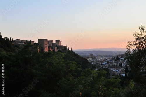 Sunset over the city of Granada, Andalusia, Spain. Alhambra palace and Albaicín Moorish quarter