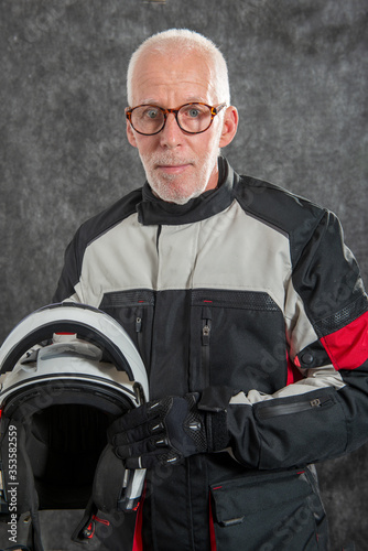 portrait of senior biker with helmet