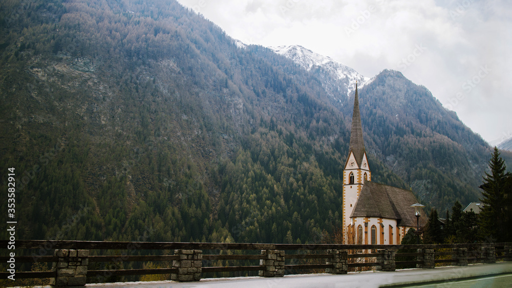 Fototapeta premium Catholic church in European mountains Alps