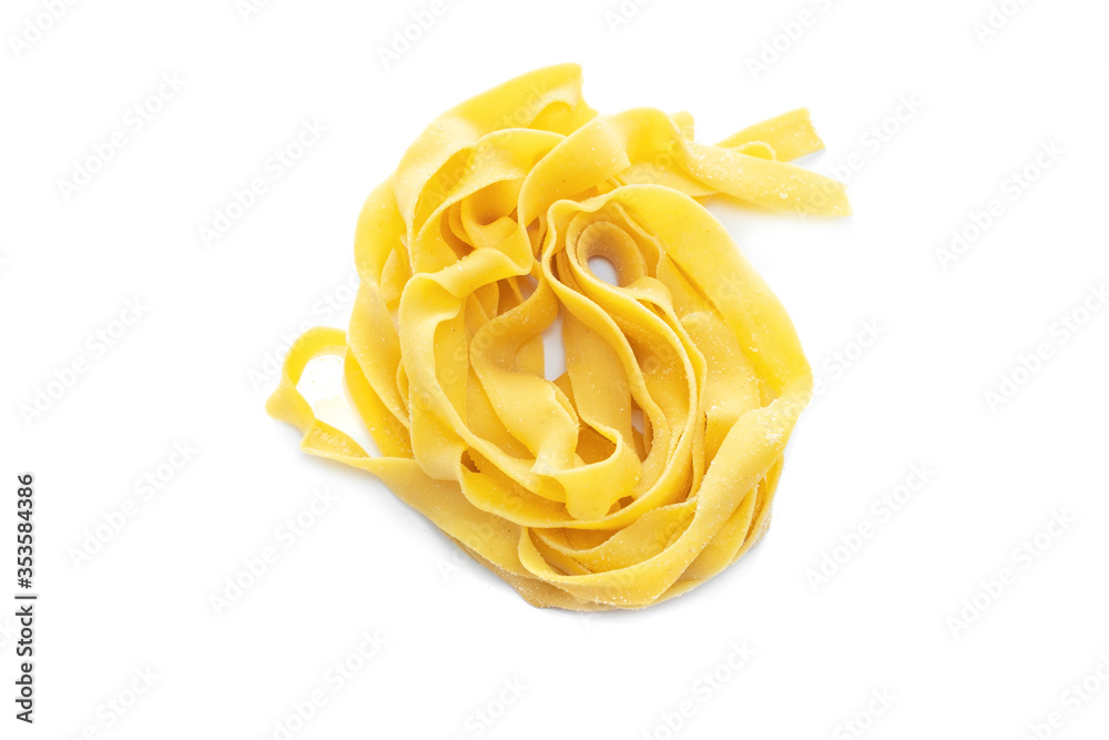 Fresh colored egg fettuccine pasta with isolated on a white background Fresh colored egg fettuccine pasta with isolated on a white background