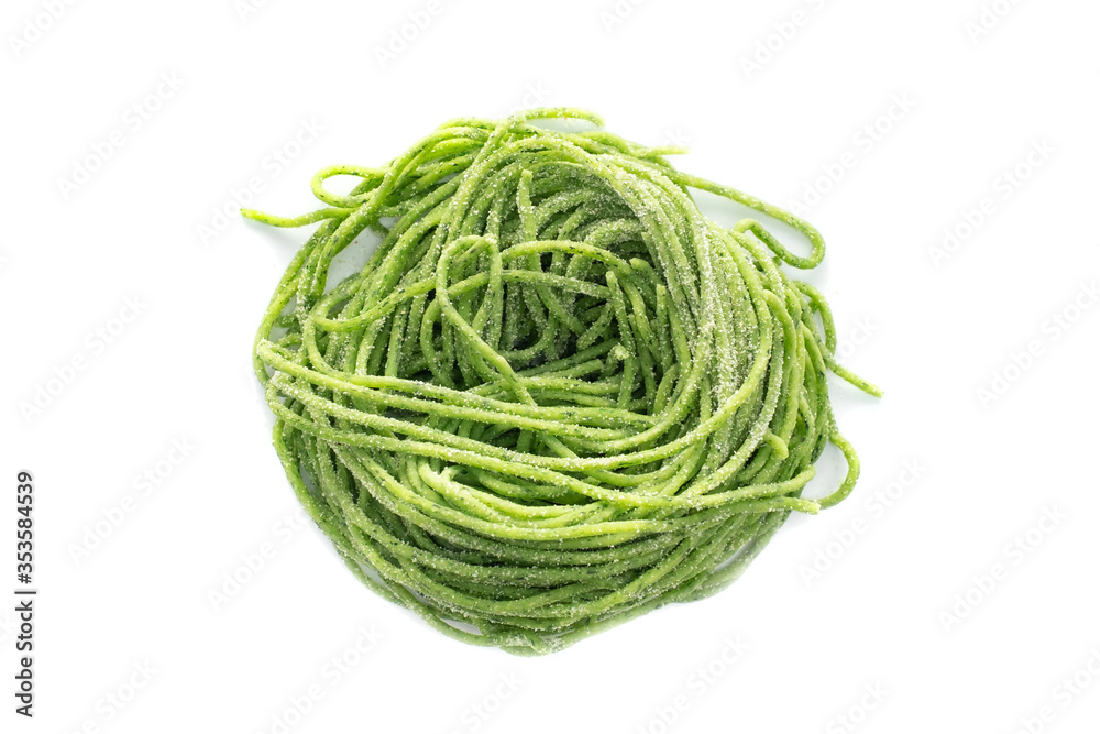 Fresh raw bio nest spaghetti pasta with spinach isolated on white background