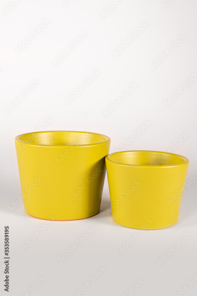 A flowerpot, flower pot, planter, plant pot. Ceramic small vase for flowers and plants A flowerpot, flower pot, planter, plant pot. Ceramic small vase for flowers and plants