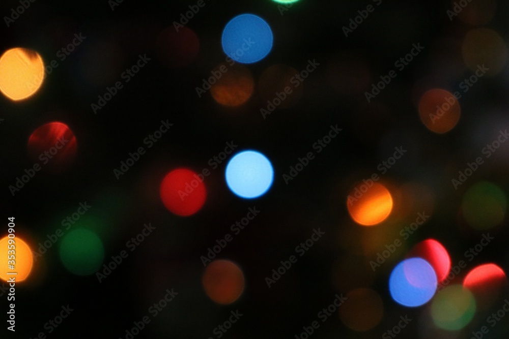 Bokeh effect on Christmas lights on a black background. Scarce circles Bokeh effect on Christmas lights on a black background. Scarce circles
