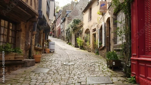 DINAN, FRANCE - APRIL 06, 2018: view of empty beautiful street with old traditional houses at the center of Dinan, Brittany, France
