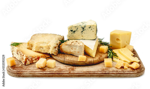 Tasty cheese plate with rosemary