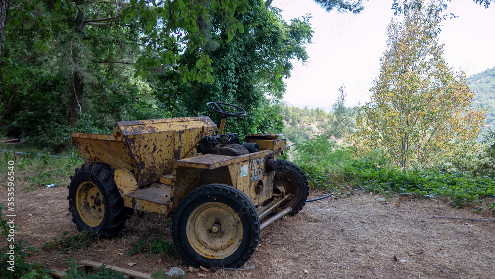 Old rusty farm tractor on hill top Old rusty farm tractor on hill top