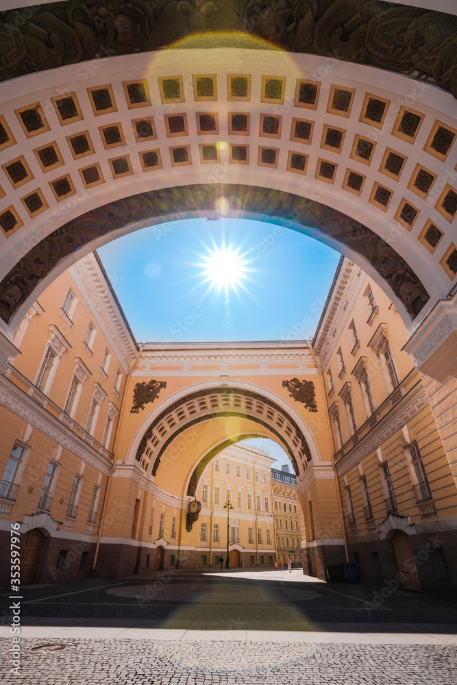 Yellow arch leading to the Palace square to the Hermitage Museum in Saint Petersburg, a tourist attraction in the summer