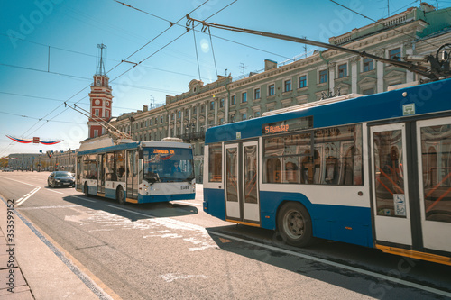 Fototapeta Naklejka Na Ścianę i Meble -  Trolleybuses travel through the streets of St. Petersburg in the city center on a summer day