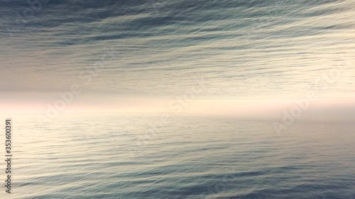 Trippy surreal 4k drone footage of  sea  early in the morning.