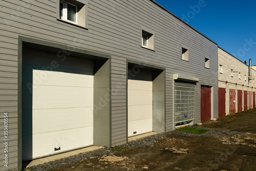 Fototapeta Naklejka Na Ścianę i Meble -  Rows of garage doors at a mini warehouse business in getto