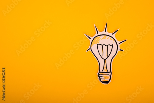 Paper bulb on a yellow background