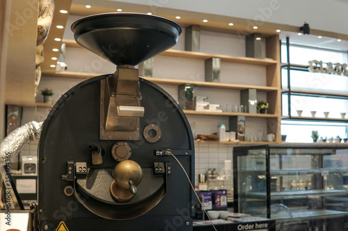 Vintage coffee roasting machine in a coffee shop