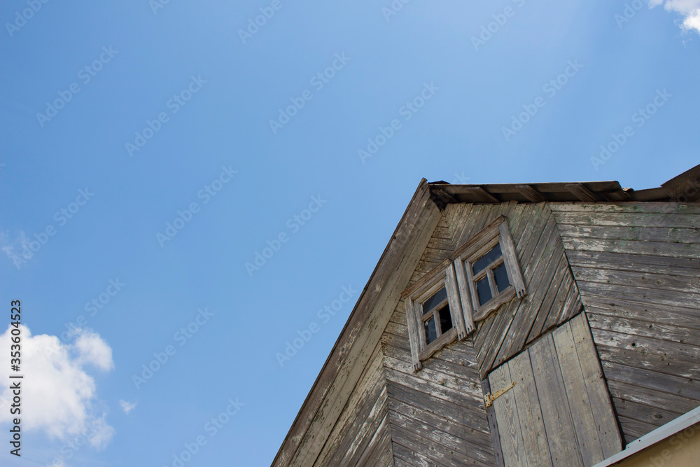 old wooden house with blue sky
