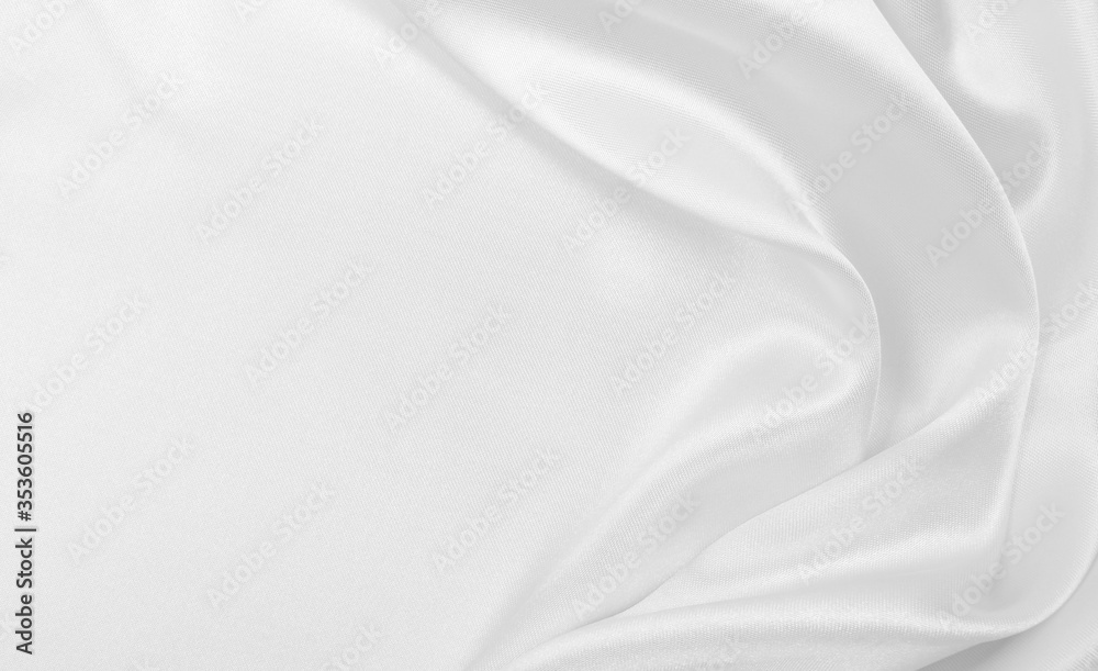 Smooth elegant white silk or satin luxury cloth texture as wedding background. Luxurious background design