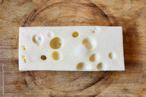 cheese isolated on a wood table