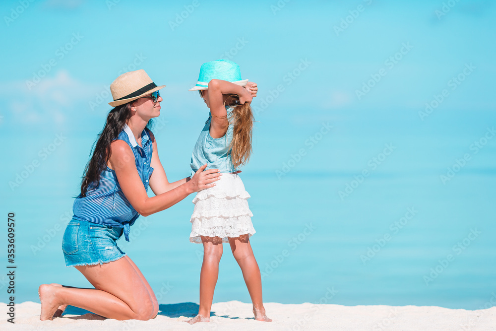© travnikovstudio - Beautiful mother and daughter at Caribbean beach enjoying summer vacation. © travnikovstudio - Beautiful mother and daughter at Caribbean beach enjoying summer vacation.