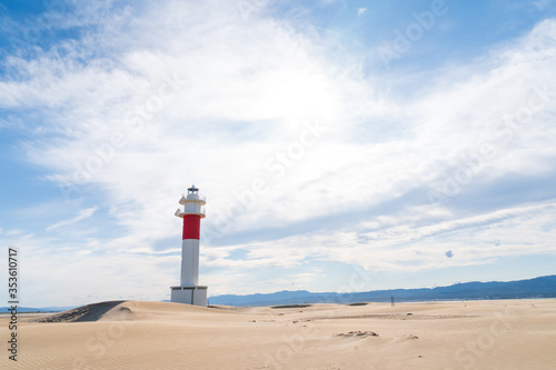 DELTA DE L'EBRE, TARRAGONA, CATALUNYA, SPAIN - JUNE 5, 2019: Beach of "punta del fangar" lighthouse "far del fangar".