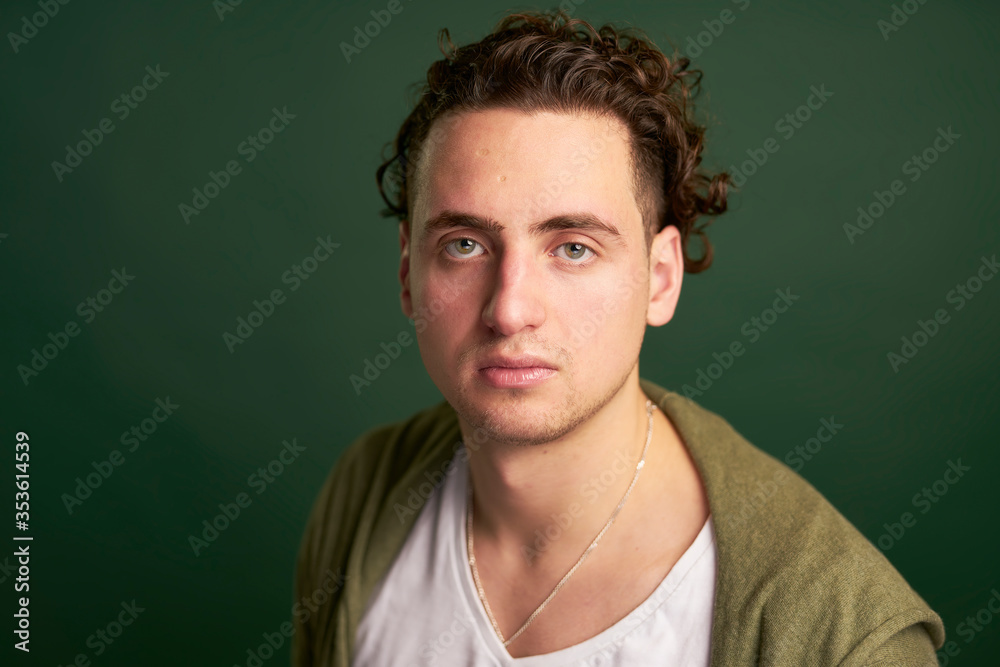 Headshots of young man with green eyes and curly hair Headshots of young man with green eyes and curly hair