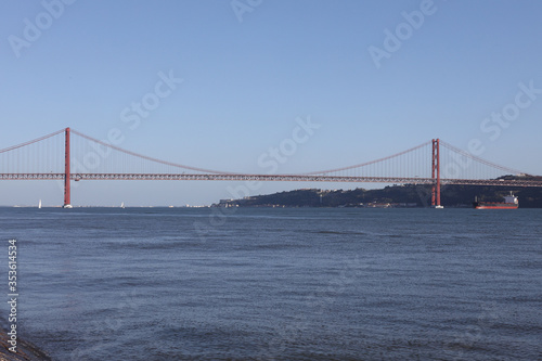 view of the cable-stayed 25th of April bridge over the Tagus in Lisbon