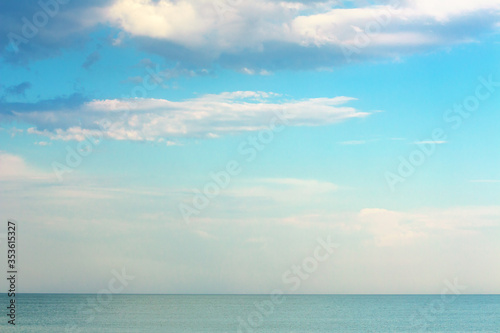 calm sea scenery with low clouds