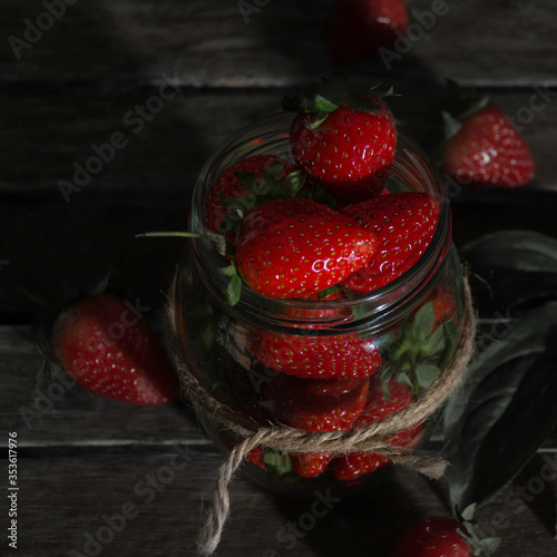 red strawberries in the wood