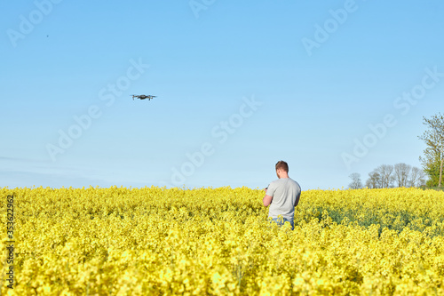 young man in a field pilot drone