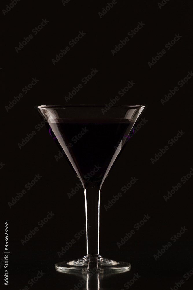 Glass of martini on a black background Glass of martini on a black background