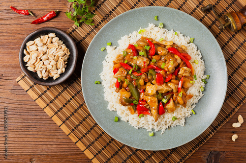 Chicken kung pao. Fried chicken pieces with peanuts and peppers. photo