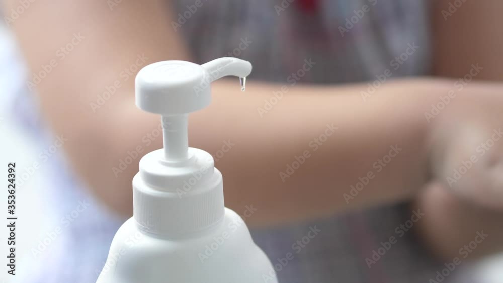 Kid Hand-held alcohol gel pump anti corona virus covid 19, healthcare concept. Kid Hand-held alcohol gel pump anti corona virus covid 19, healthcare concept.
