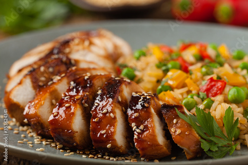Grilled chicken breast in teriyaki sauce. Served with brown rice and vegetables.