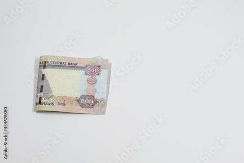 A close up view of United Arab Emirates currency, with white background, UAE Dirhams