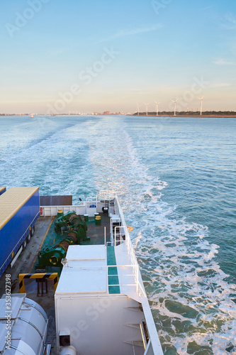 Rear stern view of ferry ship carrying commercial trucks as cargo, leaving Rotterdam port in the Netherlands heading to Hull in the UK