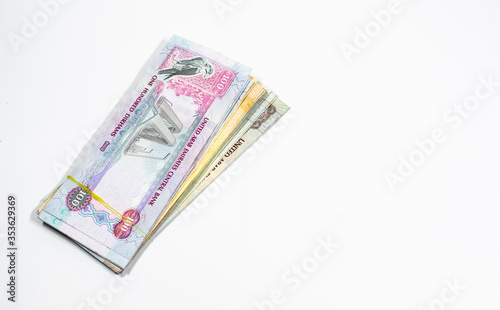 A close up view of United Arab Emirates currency, with white background, UAE Dirhams