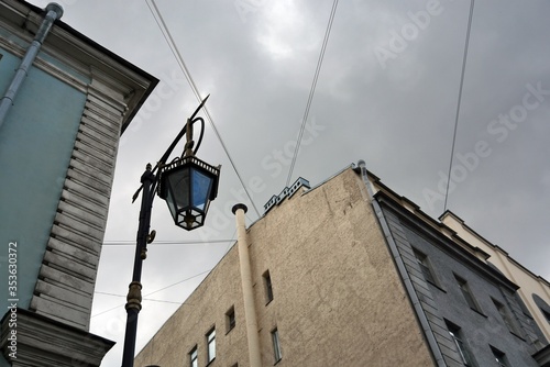 Vintage style lantern in Saint-Petersburg, Russia. Blue sky background.