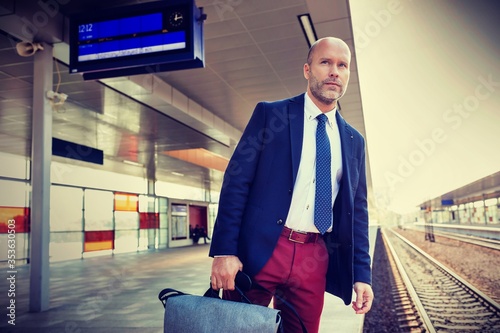 Portrait of mature man standing while waiting for the train in station
 photo