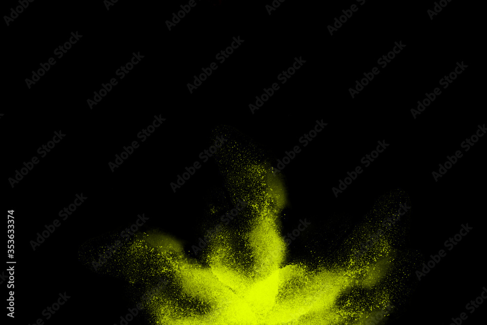 yellow color powder and dust explosion isolated with black wide background. Illustration of colored background