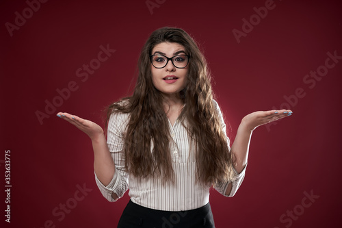 Photography Young businesswoman shrugging