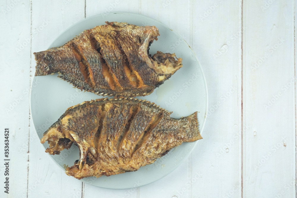 Thai food deep fried Tilapia fish on plate