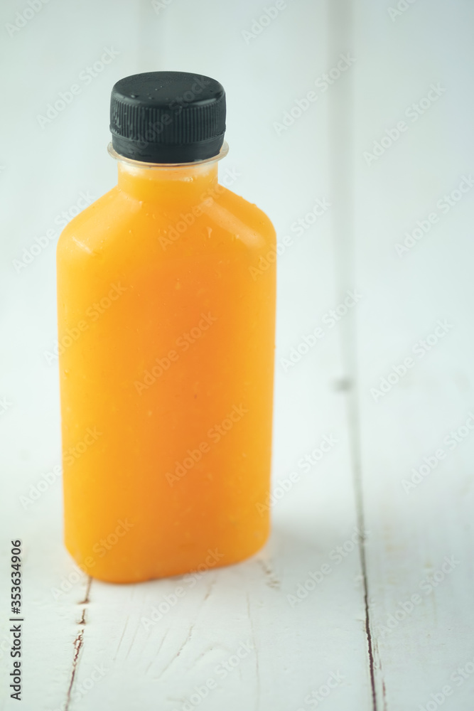 One bottle with tasty drink of orange juice One bottle with tasty drink of orange juice