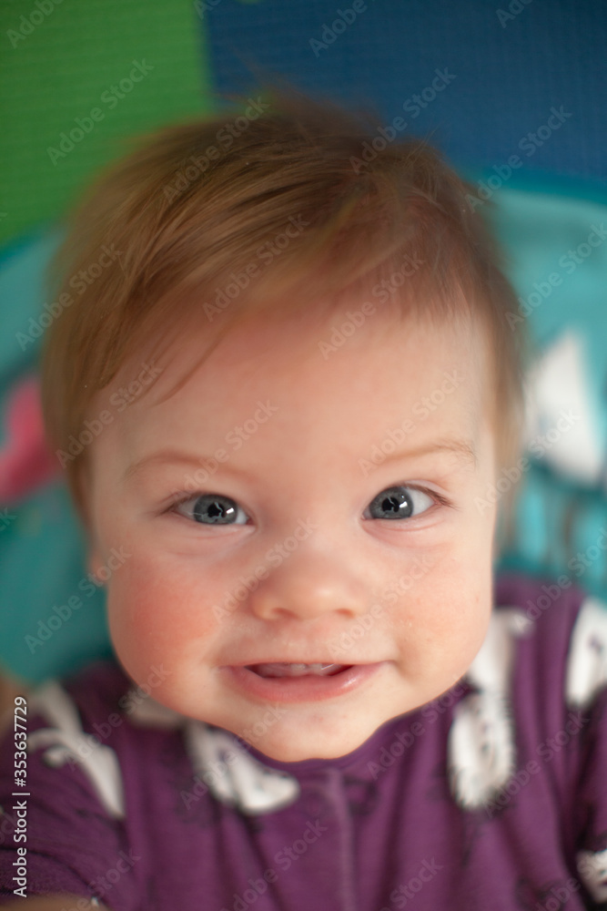 infant in bed with first teeth smiling infant in bed with first teeth smiling