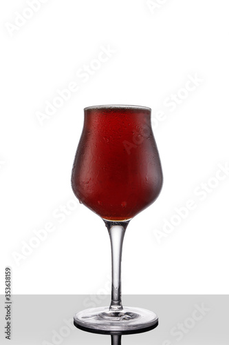 Red ale beer in tulip wineglass isolated on white background photo