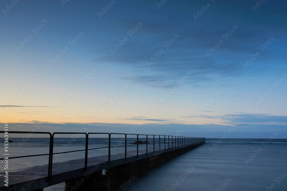 Bath pier during sunset on the island of Gotland in Sweden Bath pier during sunset on the island of Gotland in Sweden