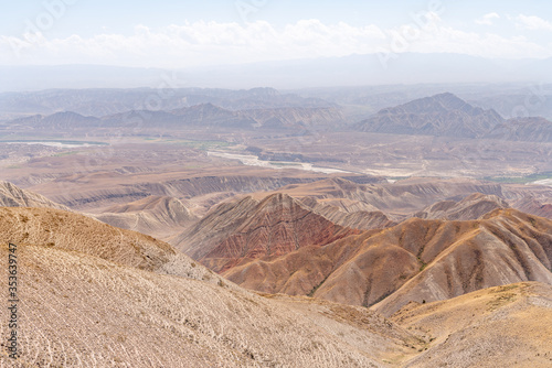 The amazing wild view of kyrgyzstan landscape full of snow peaks and wilderness photo